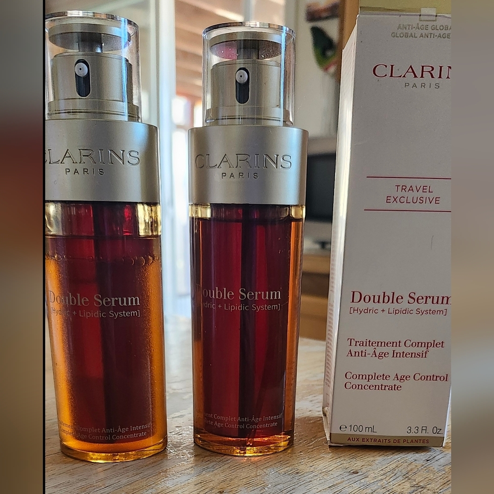 Clarins Double Serum Bottles in Amber and Red